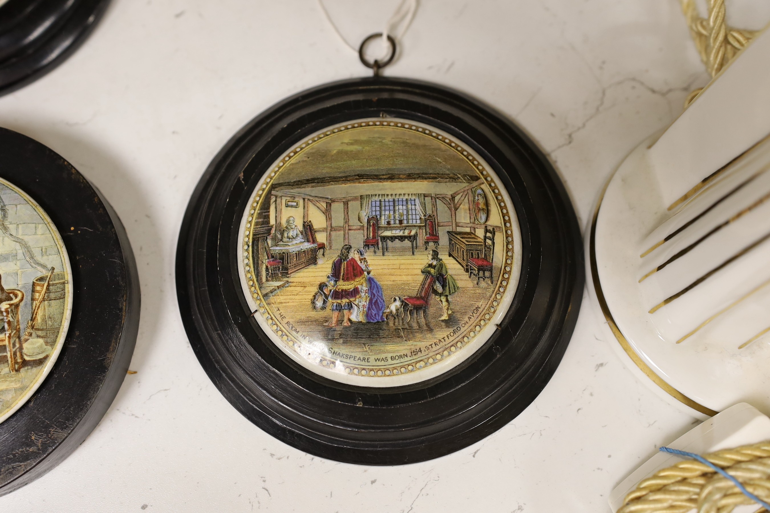 Ten 19th century framed ceramic pot lids